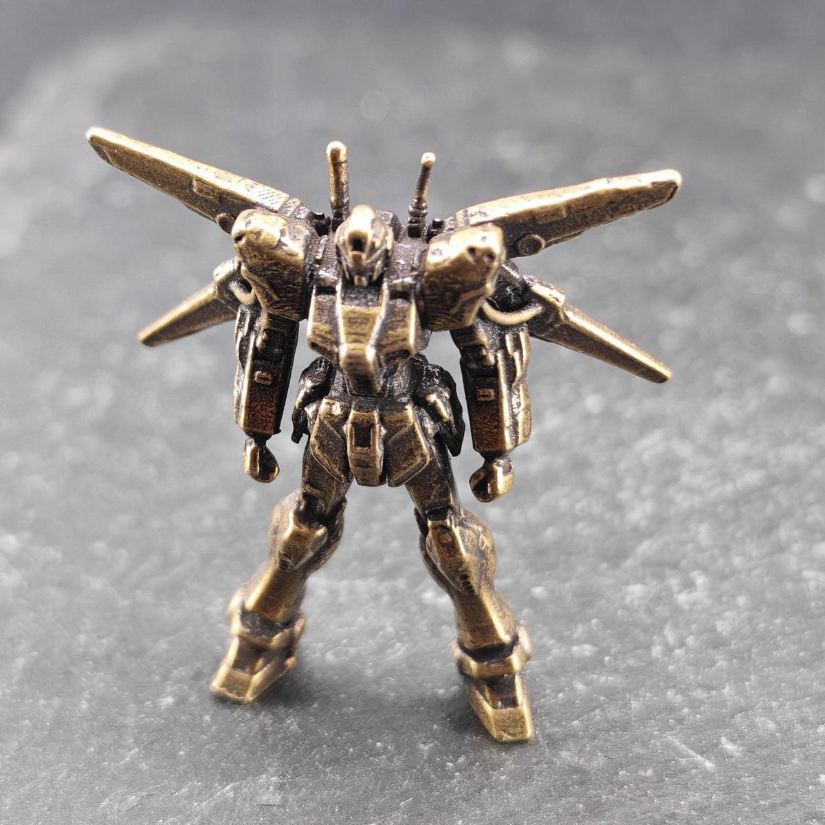 Brass Winged Mobile Suit Micro Figurine — Sci-Fi Mecha Diorama & Terrarium Sculpture