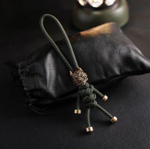 Brass Mythical Mask Paracord Keychain — EDC Backpack Charm & Car Ornament
