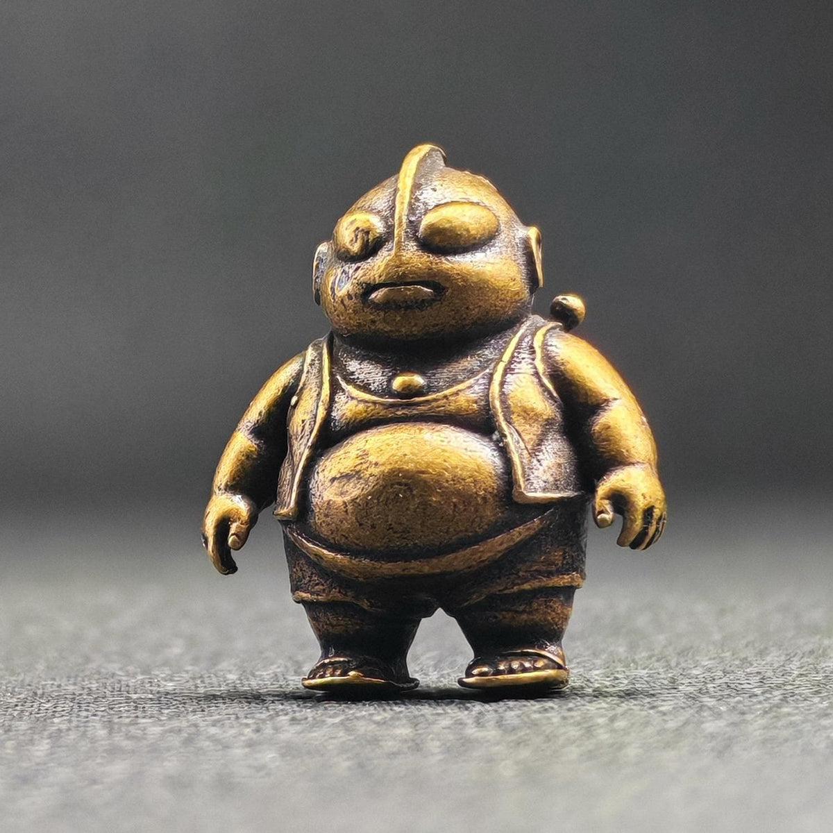Brass Chubby Retired Hero Figurine — Parody Superhero Miniature & Novelty Desk Ornament