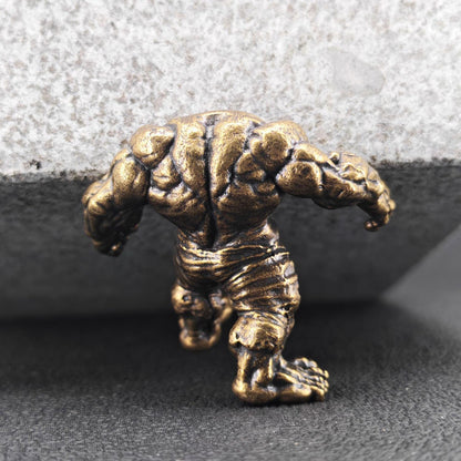 Brass Muscle Monster Figurine — Man Holding a Giant Brass Sculpture & Fantasy Desk Piece