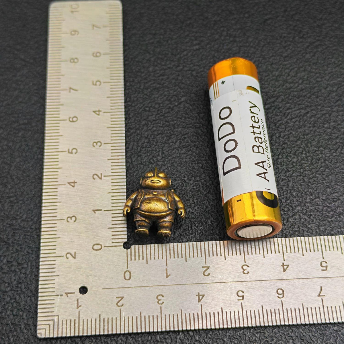 Brass Chubby Retired Hero Figurine — Parody Superhero Miniature & Novelty Desk Ornament