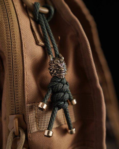 Brass Mythical Mask Paracord Keychain — EDC Backpack Charm & Car Ornament