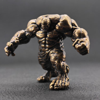 Brass Muscle Monster Figurine — Man Holding a Giant Brass Sculpture & Fantasy Desk Piece